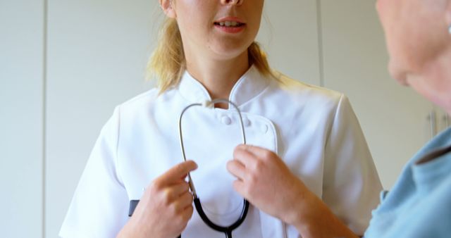 Female Nurse Preparing Stethoscope for Medical Exam - Download Free Stock Images Pikwizard.com