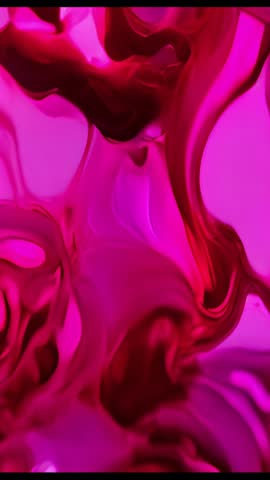 Injecting magenta fluid making branching swirls under pink light | Vertical fluid art