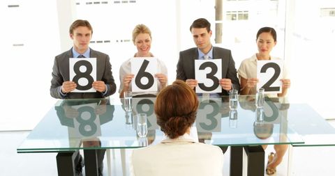 Judges scoring professional interview candidate