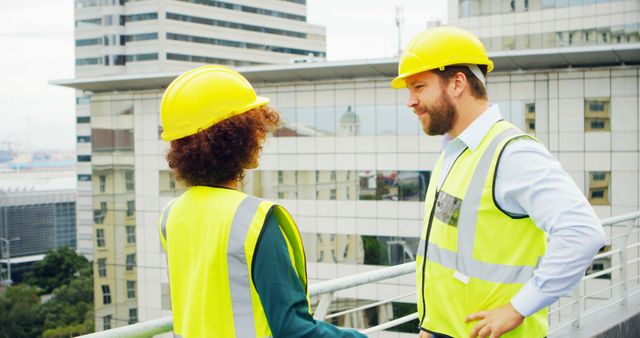 Engineers Collaborate at Urban Construction Site - Download Free Stock Images Pikwizard.com