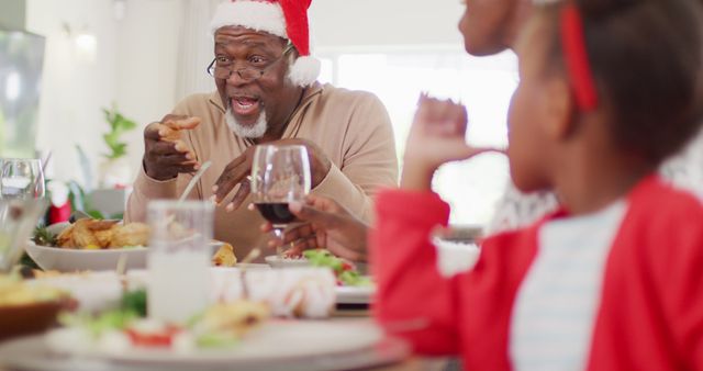 Portrait of happy african american family having christmas dinner. Spending quality time with family at christmas concept.