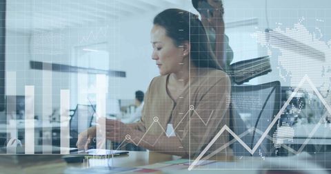 professional woman analyzing digital data in modern office environment - Download Free Stock Images Pikwizard.com