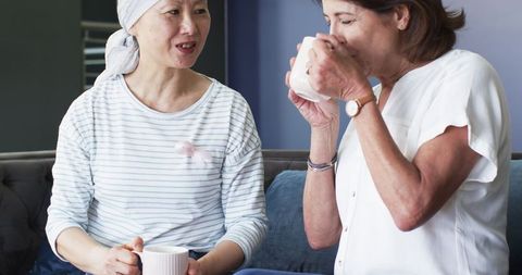 Diverse Senior Women Chatting and Drinking Coffee Together