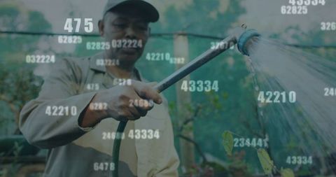 Garden worker watering plants with digital overlay