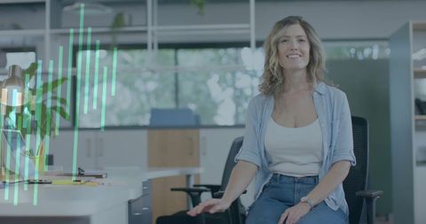 Smiling Professional Woman in Modern Office with Financial Data Overlay