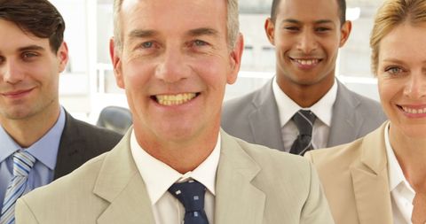 Diverse Group of Professionals Smiling in Office Setting