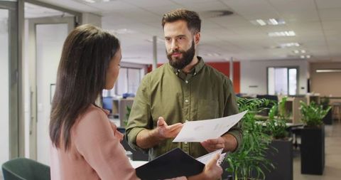 Diverse Colleagues Collaborating with Documents in Open Office