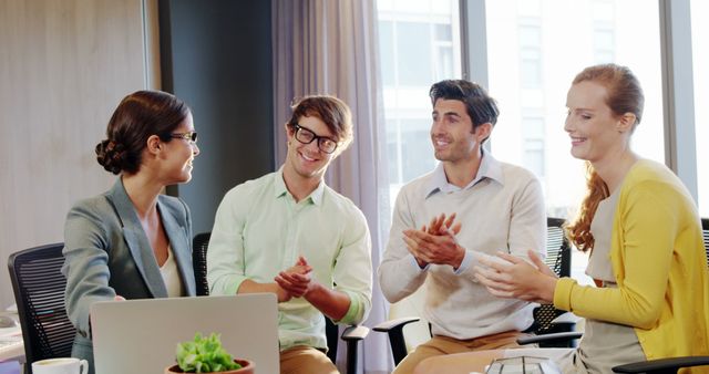 Happy multicultural business team applauding in office setting - Download Free Stock Images Pikwizard.com