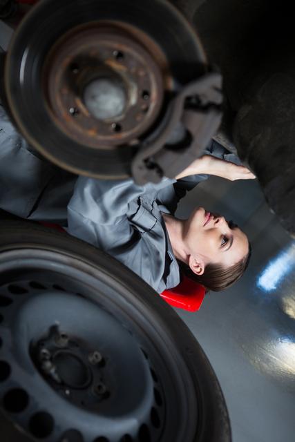 Female Mechanic Repairing Car in Auto Workshop - Download Free Stock Photos Pikwizard.com