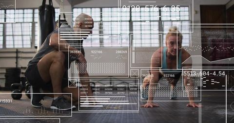 Trainer coaching female trainee performing plank with futuristic fitness hud overlay