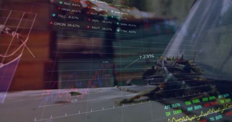 Overlay Financial Data on Wooden Desk with Laptop and Plants