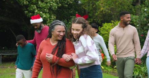 Happy family celebrating festive season outdoors with joy