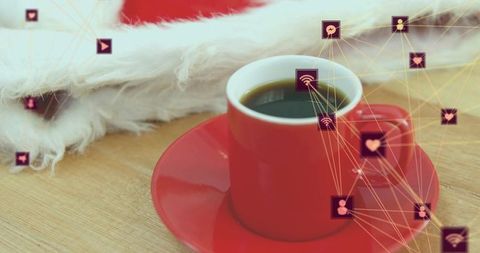 Sitting red coffee cup with purple social network icons overlay on wood table