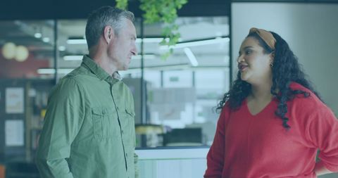 Colleagues Discussing Work in Modern Office Setting