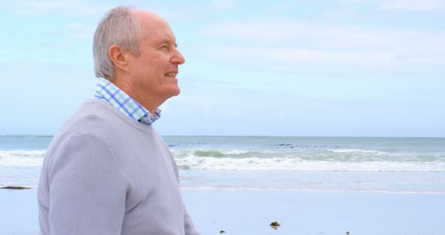 Senior Man Enjoying a Scenic Beach View - Download Free Stock Images Pikwizard.com