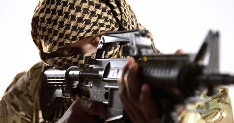 Soldier in Military Gear Aiming Rifle for Tactical Operations - Download Free Stock Images Pikwizard.com