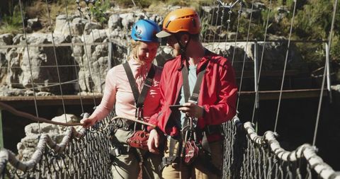 Happy Couple Crossing Mountain Bridge with Smartphone Adventure - Download Free Stock Images Pikwizard.com
