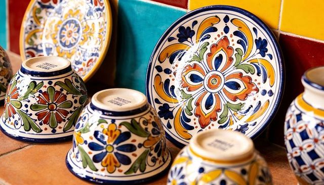 Hand-painted talavera ceramics featuring colorful floral and geometric patterns