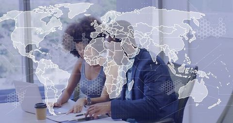 Global Business Collaboration: Coworkers Reviewing Documents with World Map Overlay
