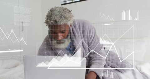 Senior Using Laptop with Financial Data Overlay