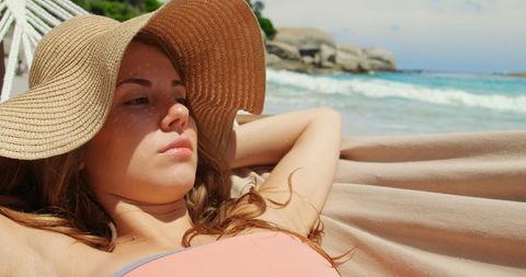 Woman Relaxing in Hammock by the Sea with Sunhat - Download Free Stock Images Pikwizard.com