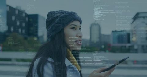 Young Woman Using Tablet with Code Overlay by Urban Waterfront