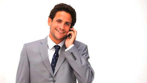 Confident Businessman Talking on Phone in Gray Suit
