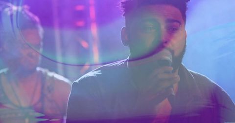 Singer Performing on Stage with Dynamic Stage Lighting