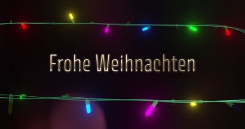 Frohe weihnachten message with festive fairy lights