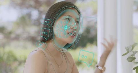 Asian woman gesturing while interacting with ar ai chat overlay in bright interior
