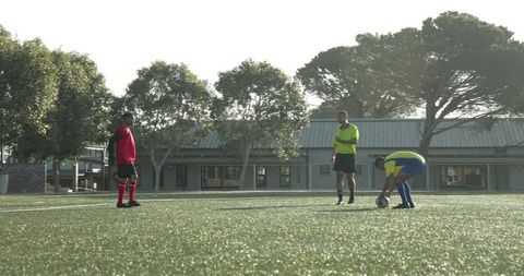 Soccer Players Preparing Match on Sunny Day