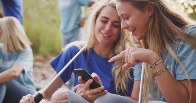 Young Blonde Women Sharing Social Media Moments During Outdoor Cleanup - Download Free Stock Images Pikwizard.com