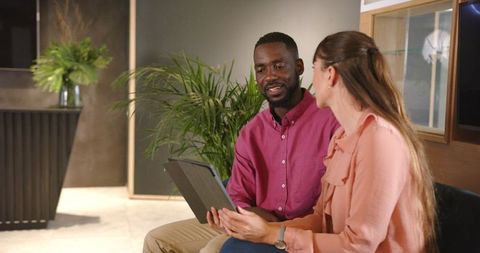 Colleagues Collaborating in Office with Tablet Technology