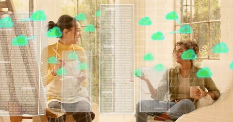 Smiling women chatting on cozy living room sofa with cloud computing network overlay