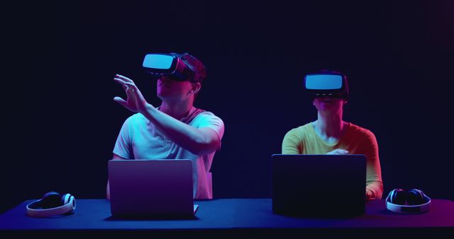 People Using Virtual Reality Headsets with Laptops in Dark Room - Download Free Stock Images Pikwizard.com