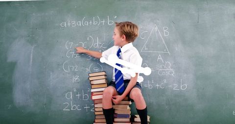 Boy Learning Mathematics in Classroom with Blackboard - Download Free Stock Images Pikwizard.com