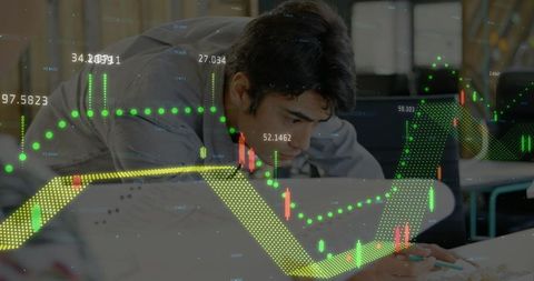 Focused Professional Analyzing Charts for Financial Insights