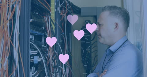 Businessman Looking at Server Rack with Animated Hearts
