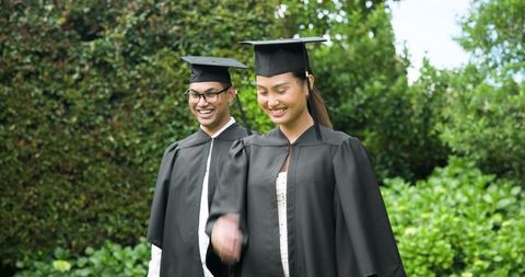 Joyful Graduates Celebrating Academic Success Outdoors Together