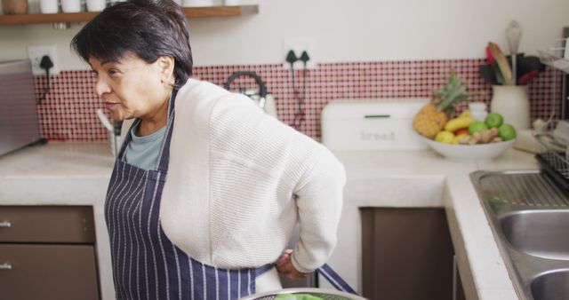 Senior Woman Preparing Food in Modern Kitchen - Download Free Stock Images Pikwizard.com