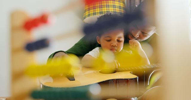 Father and Son Bonding Over Guitar - Download Free Stock Images Pikwizard.com