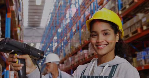 Female Warehouse Worker Using Stock Scanner in Warehouse