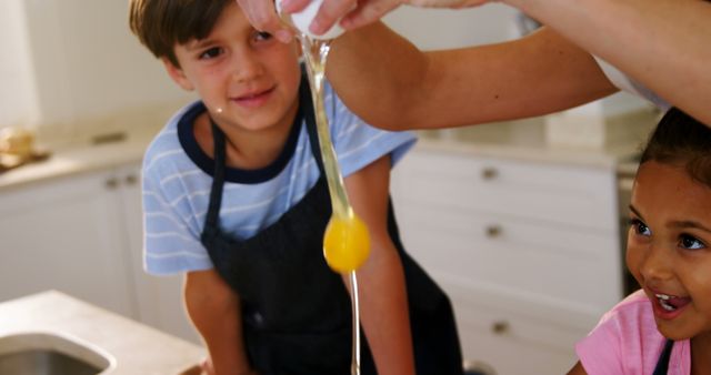 Children Cracking Egg for Baking Activity in Kitchen - Download Free Stock Images Pikwizard.com