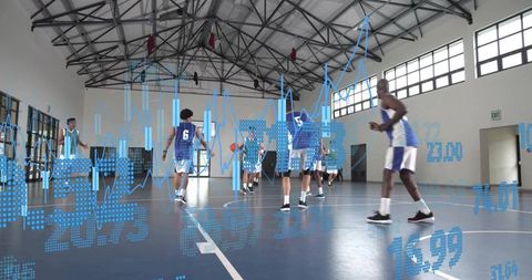 Basketball team practicing with digital performance analytics overlay in indoor gym