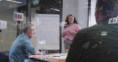 Diverse Team Brainstorming in Modern Office with Augmented Reality Graphics