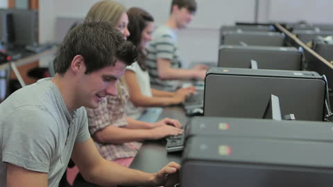 Happy Students Engaged in College Computer Lab