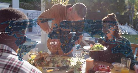 Father carving turkey sunlit backyard family feast with holographic global network overlay