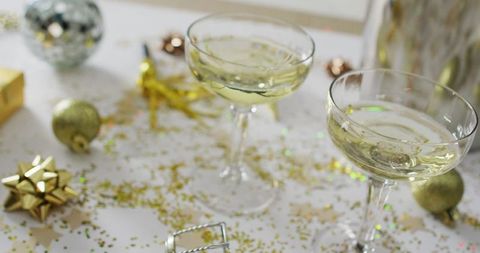 Champagne glasses with new year’s eve decorations