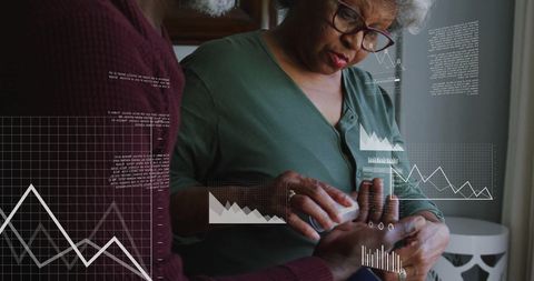 Senior Couple Engaged in Digital Financial Data Analysis