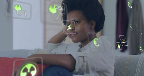 Woman contemplating energy choices with floating emissions and finance icons